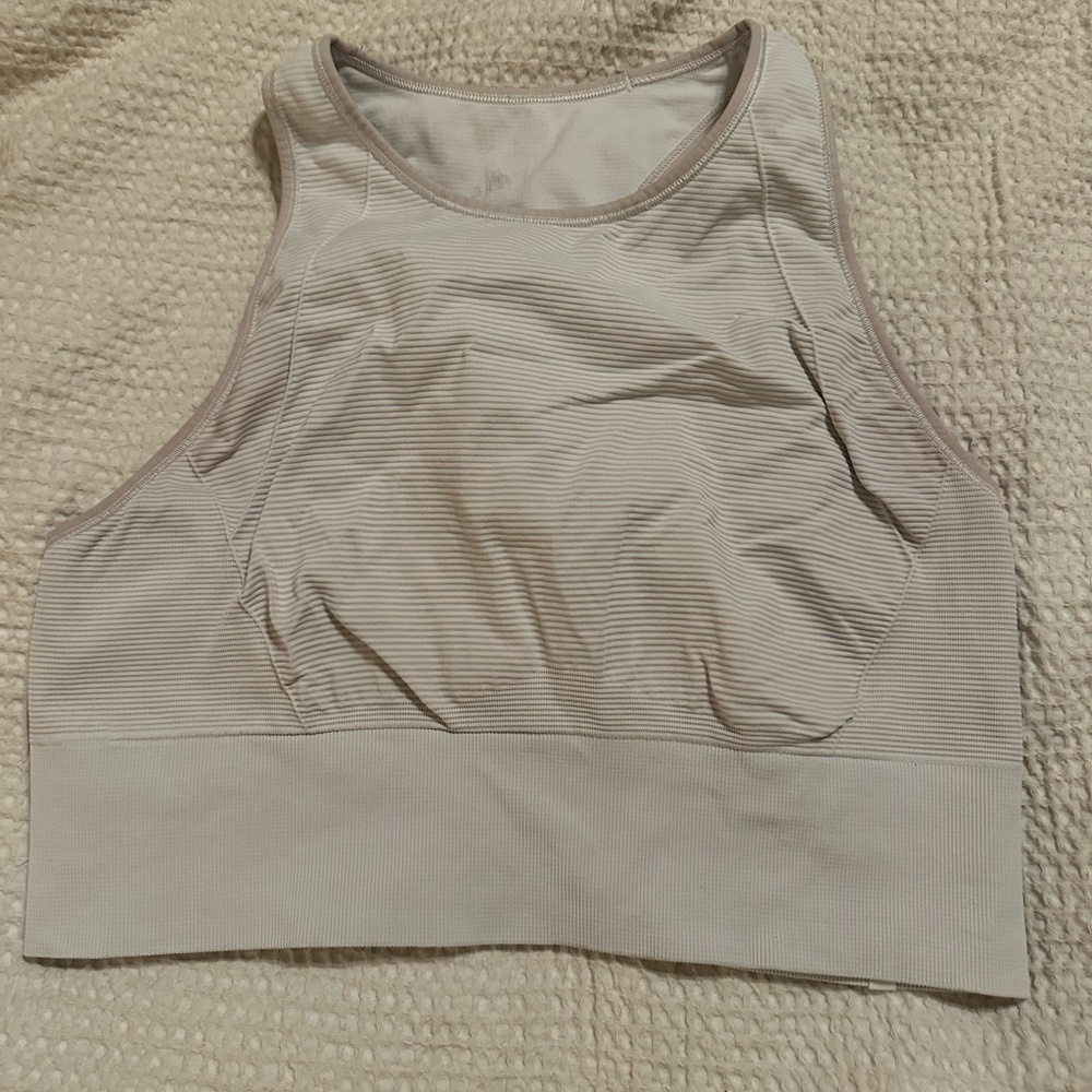 Lululemon white sports bra-changes color with pink lines with sun exposure.